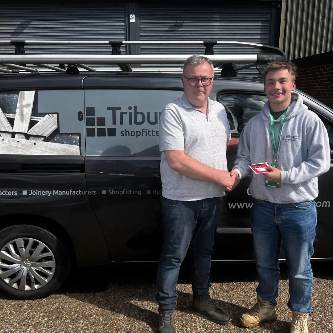 Apprentice of the month Dan Jefferies with his employer smiling for a photo